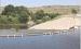 Since July 31, PVC pipe has been siphoning water from Lake Scott at the spillway with plans to eventually draw down the lake level by three to five feet. (Record Photo)