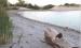 Siphon tubes at the spillway have drained about 3-1/2 feet of water so far from Lake Scott, which is evident by the amount of shoreline that’s been exposed. (Record Photo)