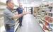 Randy Evans (foreground) and Casey Venters, director of the Lane County Community Foundation, discuss the work that’s being done to prepare the grocery store for its grand opening on June 27. (Record Photo)