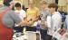 SCHS seniors visiting with a representative from Wichita State University Vo-Tech during College Day are (from left) Ian Rodriguez, Mickey Gossman, Carson Bennett and Martin Purma. (Record Photo)