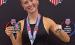 Maddie Goode with her awards, including a national championship ring, after winning the AAU pole vault competition in the 15-16-year division.