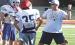 SCHS head coach Jim Turner explains how he wants offensive linemen to take the defender out of the play during Monday’s camp. (Record Photo)
