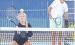 Allie Plummer prepares to hit a return shot at the net while longtime coach and clinician Dave Hawley looks on during the Scott City tennis camp. (Record Photo)