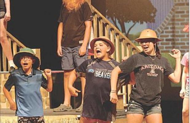 The Central Park zookeepers perform a song during rehearsal for “Madagascar: A Musical Adventure for Kids.” Zookeepers are (from left) Noah Keith, Lynnlee Cline and Layla Belcher. Performances are Sunday and Monday at the high school. (Record Photo)