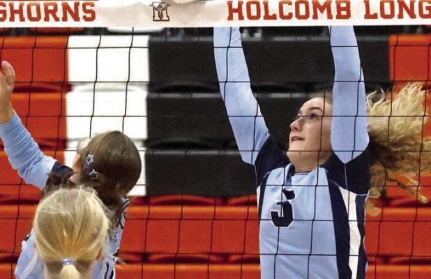 Getting a block against Cimarron during regional tournament action on Monday is SCHS sophomore Adda Gossman. (Record Photo)