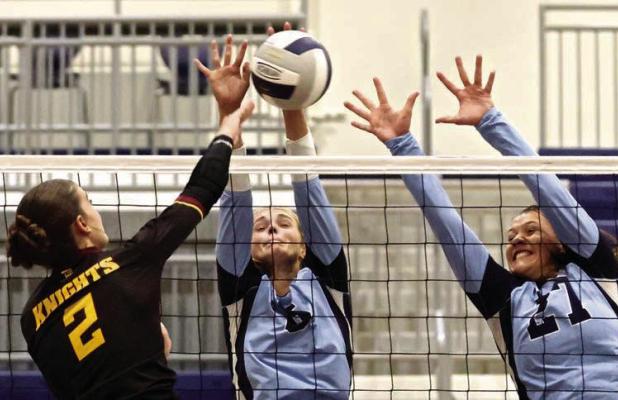 SCHS seniors Katie Weathers (left) and Lily Lightner combine for a block during Tuesday’s win over Victoria on the home court. (Record Photo)