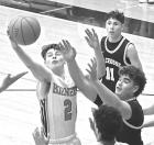 Dighton junior Shawn Redburn grabs a rebound during Tuesday’s game against LaCrosse on the home floor. (Record Photo)