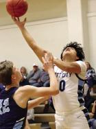 Scott City’s Anjel Gonzalez scores a basket during last Friday’s action against Cimarron. (Record Photo) Scott City’s Anjel Gonzalez scores a basket during last Friday’s action against Cimarron. (Record Photo)