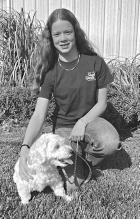 Scott County 4-Her Bryn Crisler and her dog, Kandy.
