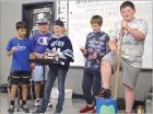SCMS fifth graders playing homemade instruments are (from left) Asher Day, Ulises Trejo, Jessa Eisenhour, Landon Cervosky and Beckum Gossman. (Lower left) Other musicians were Jayden Nelson, Hayden Martin and Brynlee Dare. (Bottom right) A big hit each ye DeGeer’s legendary life put to music