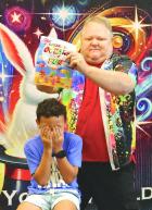 Ashton Cooper, Scott City, covers his face as the young audience prepares to throw invisible crayons at a coloring book held by “Dan the Magic Man” during Tuesday’s program at the Scott County Library. (Record Photo)