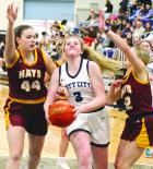 SCHS senior Brooke Strine drives between two Hays High defenders for a basket during Tuesday’s non-league action on the home floor. (Record Photo) SC girls tumble to Hays, 46-32