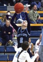 Scott City senior Kendall Gentry puts up a shot in the paint during Tuesday’s win at Cimarron. (Record Photo)