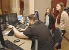 Rob Alexander, a CT technologist at the Scott County Hospital, explains what the scanned images reveal to SCHS juniors Haylie McDaniel (left) and Peyton Gentry. (Record Photo)