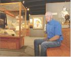 Scott City native Jerry Thomas reflects amid the many historical artifacts, artwork and documents that make his award winning gallery one of the premier sites not just in the Midwest, but throughout the U.S. (Record Photo)