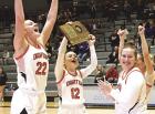Dighton seniors Lani Speer (far left), Kenzie Zimmerman and Carlie Speer celebrate their sub-state championship win. (Record Photo)
