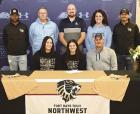 Jayden O’Brien (front, center) is joined by her parents and coaches when signing a letter of intent with Fort Hays Tech Northwest. Her parents are Nichole and Jay O’Brien. (Back row, from left) FHTN assistant coach Daniel Dixon; SCHS head track coach 