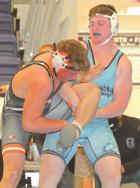 SCHS senior Jeffery Nix works for a takedown against Holcomb’s Kolby Johnson on his way to a fall during the consolation finals in the 182-pound division. (Record Photo) don’t blink