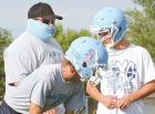 SCHS assistant coach Michael McEachern visits with two linemen about what he’s looking for with blocking technique. (Record Photo) Article Image Alt Text