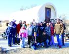 Participants in this year’s First Day Hike outside the Conestoga Wagon which has been added to the overnight cabin opportunities at the lake. (Record Photo)