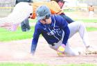 The Ulysses first baseman dives over the top of Avery Radke in an effort to grab a wild pickoff attempt during Tuesday’s home double-header. Radke would advance to third base on the play. (Record Photo)