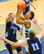 SCHS senior Eloy Ruelas drives between two defenders as he gets to the rim during last Friday’s GWAC win over Cimarron. (Record Photo) SCHS senior Eloy Ruelas drives between two defenders as he gets to the rim during last Friday’s GWAC win over Cimarron. (Record Photo)