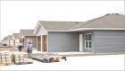 The two duplexes in the foreground are nearing completion and will be ready for tenants in late December or early January. Immediately to the west of these duplexes is the community center that is also nearing completion. (Record Photo)