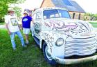 (Above) A look inside Keystone Gallery with the 24-foot seaway mural in the background. (Right) Chuck Bonner, Barbara Shelton and their son, Logan Bonner, with a Keystone Gothic pose in 1986. (Below) Bonner and Shelton with their 1948 Suburban, ‘Spiker 