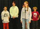 SCMS eighth grader Hannah Winter (at the microphone) was the champion of the Scott County spelling bee held on Tuesday morning. Behind her are (from left) Keagan Patty, Joslyn Frohlich, Jagger Spangler-Carlson and Marshall Hickey. (Record Photo) Winter is county spelling champ