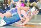Amya Parker, a Scott City sophomore, takes Graysea Gardenhire of Clearwater to her back for near-fall points in the third place match at the Class 4A regional tournament. Parker claimed a bronze medal in the 120-pound division and qualified for the state 