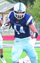 Jackson Rumford in action last season when he played tight end and defensive end for the Beavers. (Record Photo) Rumford will continue career with KSU football
