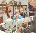 Hexlee Savolt, 5, Scott City, enjoys her free vanilla shake while her sister, Brilynn Lopez, and mother, Whitney Savolt, await theirs as they are being prepared by Steve Payne. The shakes were being prepared Sunday afternoon at the restored soda fountain Hexlee Savolt, 5, Scott City, enjoys her free vanilla shake while her sister, Brilynn Lopez, and mother, Whitney Savolt, await theirs as they are being prepared by Steve Payne. The shakes were being prepared Sunday afternoon at the restored soda fountain