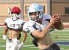 Senior Kevin Wiebe turns up the field after making a catch during a summer practice session. (Record Photo)