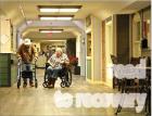 Two residents in the main hallway connecting the east and west wings at Park Lane Nursing Home. (Record Photo) Road to recovery