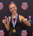 Maddie Goode with her awards, including a national championship ring, after winning the AAU pole vault competition in the 15-16-year division.