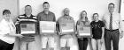 Dana Pfanenstiel, chapter president of the Daughters of the American Revolution (left) and DAR member Brenda Kough (second from right) present braille flags to USD 466 administrators (from left) Dustin Hughes, Corbin Janssen, Aaron Dirks, Shawn Roberts an