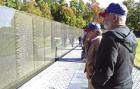 Former Scott City mayor and Vietnam veteran Dan Goodman (foreground) along with Lloyd Foster look over names on the Vietnam Wall Memorial in Washington, D.C. Honor Flight brings back the