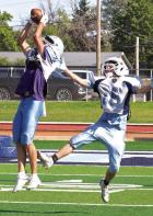 SCHS senior Cooper Irvin leaps for a catch in front of freshman defensive back Brogan Dirks during Saturday’s scrimmage. (Record Photo)