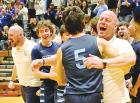 SCHS head coach Brian Gentry gives junior Drew Metzger a hug as the Beavers celebrate a 54-38 win over Beloit in the Class 3A sub-state championship game last Friday. (Record Photo)