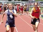 Scott City seventh grader Charlotte Frank sprints to a first place finish in the 100m during the league track meet. (Record Photo) Scott City seventh grader Charlotte Frank sprints to a first place finish in the 100m during the league track meet. (Record Photo)