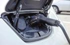 An electric vehicle plugs in to a Level 2 charging station in Olathe. Electric cars ready for long, rural Kansas commutes