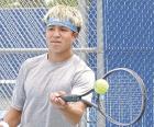Scott City junior Emilio Alarcon hits a return shot during the doubles championship match in the GWAC tournament on Monday. (Record Photo)