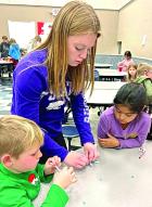 Manning Jayhawkers help SCORE youth with Christmas craft project