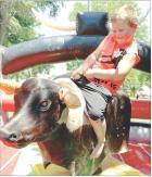 Maverick McEachern, 5, hangs on to the wild bull long enough for a full ride during the Blue 4 Blue fundraiser sponsored by the Scott City Police Department and Scott County Sheriff’s Department last Saturday in Patton Park. Money raised during the even