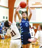 SCHS sophomore Drew Metzger puts up a shot during Friday’s action against Holcomb. (Record Photo)