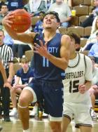 SCHS senior Alex Tarango drives the baseline for a basket against Garden City during the Roundball Classic on Saturday evening. (Record Photo)