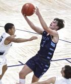 SCHS junior Avery Radke drives to the basket for two points during second half action at Cimarron. (Record Photo)