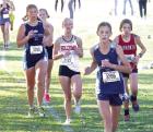 SCHS freshman Brailey Cook (3256) and junior teammate Belle Trout (3260) run near the front of the pack during the Class 3A regional meet held at Norton last Saturday. (Record Photo)
