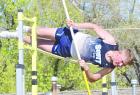 Scott City senior Kevin Wiebe barely clears the bar in the pole vault at the Ulysses Invitational last Thursday. Wiebe cleared 12-feet for a career best and a gold medal. (Record Photo)