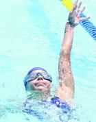 Meika Dirks competes in the 50m backstroke. (Record Photo)